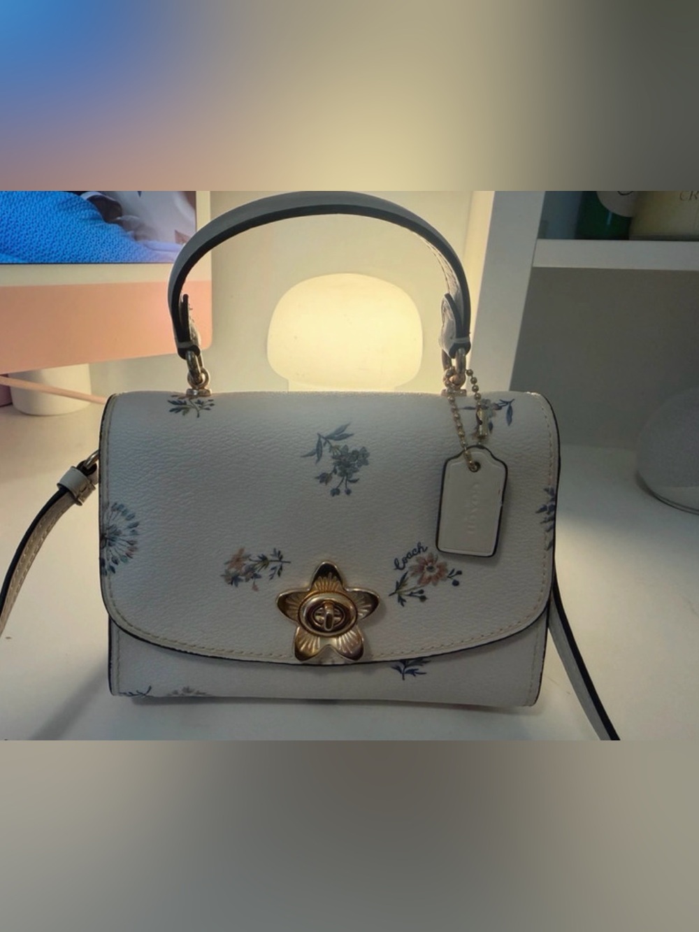 Coach Micro Tilly Top Handle bag in a white dandelion floral print